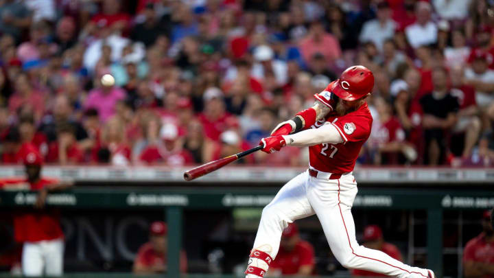 Cincinnati Reds outfielder Jake Fraley (27) hits a 3-run home run in the fifth inning of the MLB game between the Cincinnati Reds and the Chicago Cubs at Great American Ballpark in Cincinnati on Wednesday, July 31, 2024.