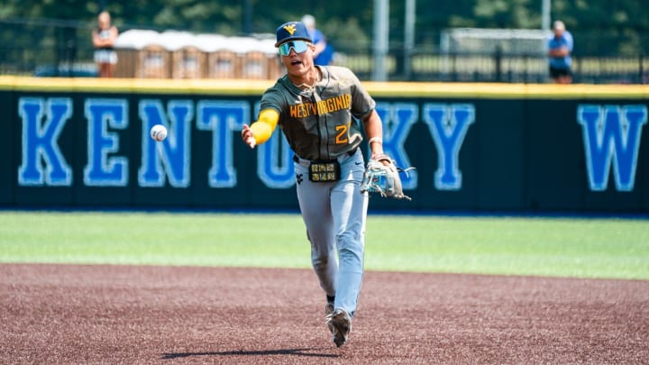 June 4, 2023; West Virginia infielder JJ Wetherholt flips a ball to second base while playing the Kentucky Wildcats.  