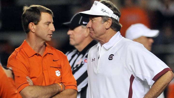 Clemson head coach Dabo Swinney and USC head coach Steve Spurrier meet at midfield before their matchup at William-Brice Stadium on Saturday, November 26, 2011.