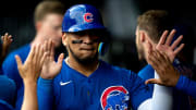 Chicago Cubs third baseman Isaac Paredes (17) high fives teammates after scoring in the third inning of the MLB game between the Cincinnati Reds and the Chicago Cubs at Great American Ballpark in Cincinnati on Wednesday, July 31, 2024.
