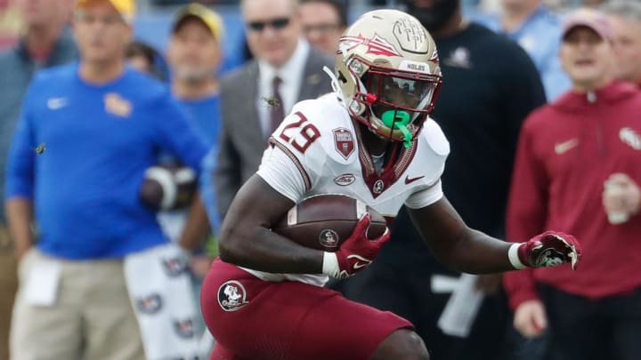 Nov 4, 2023; Pittsburgh, Pennsylvania, USA;  Florida State Seminoles running back Rodney Hill (29) runs after a catch against the Pittsburgh Panthers during the first quarter at Acrisure Stadium. Mandatory Credit: Charles LeClaire-USA TODAY Sports