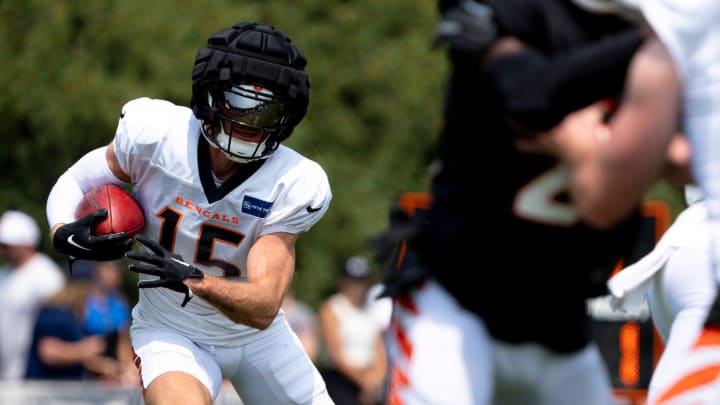 Cincinnati Bengals wide receiver Charlie Jones (15) runs with the ball at Cincinnati Bengals training camp on the Kettering Health Practice Fields in Cincinnati on Sunday, Aug. 4, 2024.