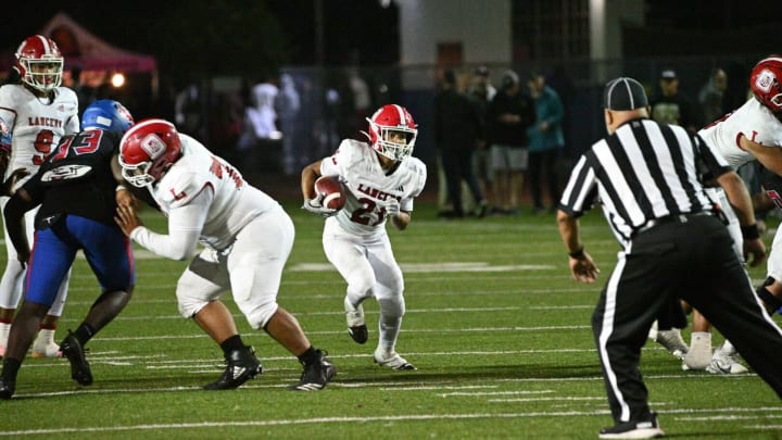 Orange Lutheran sophomore running back Jae Nembhard runs against Gardena Serra on Friday, Aug. 23, 2024.