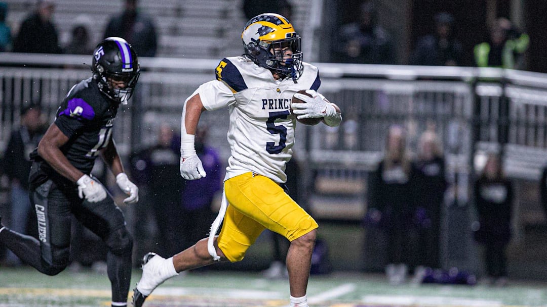 Andrew Beard of Prince Avenue breaks through the middle of Calvary's defense to score a touchdown on Nov. 29, 2024.