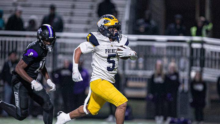 Andrew Beard of Prince Avenue breaks through the middle of Calvary's defense to score a touchdown on Nov. 29, 2024.