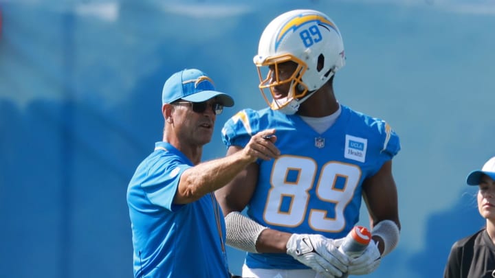 Jul 24, 2024; El Segundo, CA, USA;  Los Angeles Chargers head coach Jim Harbaugh talks with tight end Donald Parham Jr. (89) during the first day of training camp at The Bolt. Mandatory Credit: Kiyoshi Mio-USA TODAY Sports