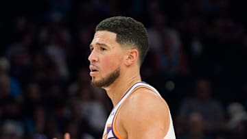 Nov 16, 2025; Phoenix, Arizona, USA; Phoenix Suns guard Devin Booker (1) reacts after a foul is call late in the first half during a game against the Atlanta Hawks at Mortgage Matchup Center. Mandatory Credit: Allan Henry-Imagn Images