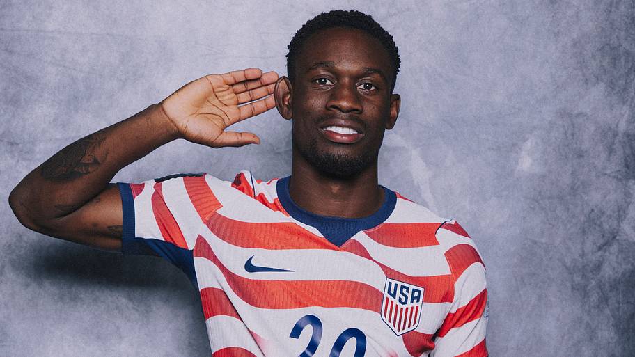 Folarin Balogun cupping his ear.