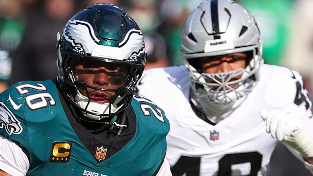 Dec 14, 2025; Philadelphia, Pennsylvania, USA; Philadelphia Eagles running back Saquon Barkley (26) runs the ball against the Las Vegas Raiders during the first quarter at Lincoln Financial Field. Mandatory Credit: Bill Streicher-Imagn Images