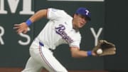 Texas Rangers right fielder Dustin Harris (38) cannot catch a fly ball during the fourth inning against the Houston Astros at Globe Life Field.