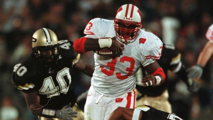 Ron Dayne bursts through big hole in the third quarter against Purdue, Saturday, November 6, 1999 in West Lafayette, Indiana. The Badgers beat the Boilermakers 28-21 and Ron Dayne ran 221 yards including a 41 yard touchdown run to win.

Ron Dayne Wis Badgers Vs Purdue