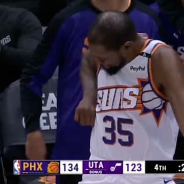 Kevin Durant celebrates after a made three by teammate Royce O’Neal.