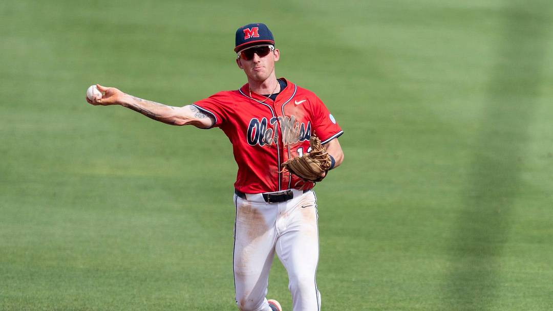 Ole Miss Rebels' Dom Decker (12) throws the ball to first base as Auburn Tigers take on Ole Miss Rebels during the NCAA Super Regional.