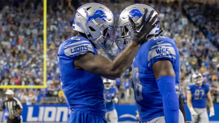 Former Detroit Lions safety C.J. Moore (38) celebrates a late fourth-quarter defensive stand with teammate Detroit Lions safety DeShon Elliott (5) at Ford Field.