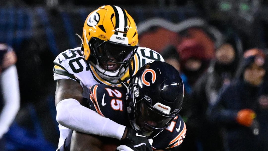 Green Bay Packers linebacker Edgerrin Cooper (56) takes down Chicago Bears running back Kyle Monangai.