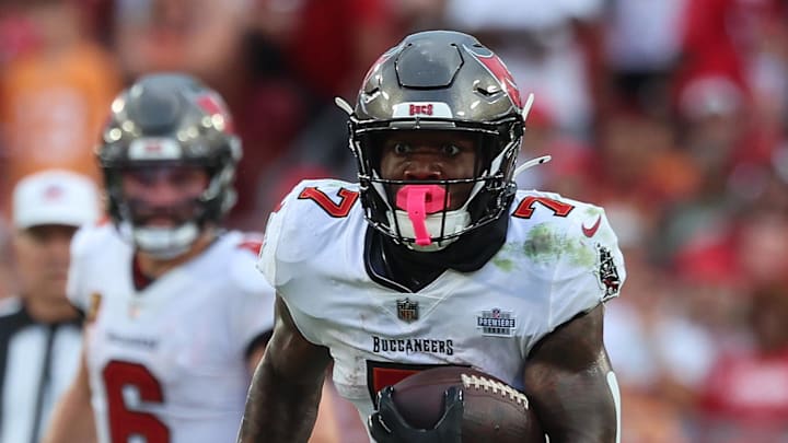 Sep 8, 2024; Tampa, Florida, USA;  Tampa Bay Buccaneers running back Bucky Irving (7) runs with the ball against the Washington Commanders during the second half at Raymond James Stadium. Mandatory Credit: Kim Klement Neitzel-Imagn Images