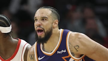 Dec 5, 2025; Houston, Texas, USA; Phoenix Suns forward Dillon Brooks (3) reacts as he runs past Houston Rockets forward Jae'Sean Tate (8) after scoring a basket during the first quarter at Toyota Center. Mandatory Credit: Troy Taormina-Imagn Images