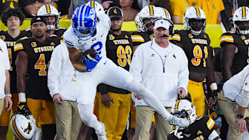 Chase Roberts hauls in a reception as BYU takes down Wyoming in Laramie.