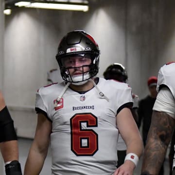 Jan 21, 2024; Detroit, Michigan, USA; (Left to right) Tampa Bay Buccaneers center Robert Hainsey (70), quarterback Baker Mayfield (6), offensive tackle Tristan Wirfs (78), and linebacker K.J. Britt (52) walk through the tunnel towards the field before a 2024 NFC divisional round game against the Detroit Lions at Ford Field. Mandatory Credit: Lon Horwedel-USA TODAY Sports