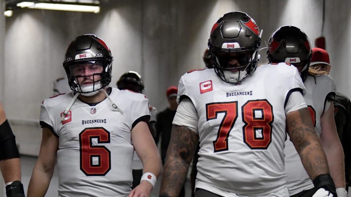 Jan 21, 2024; Detroit, Michigan, USA; (Left to right) Tampa Bay Buccaneers center Robert Hainsey (70), quarterback Baker Mayfield (6), offensive tackle Tristan Wirfs (78), and linebacker K.J. Britt (52) walk through the tunnel towards the field before a 2024 NFC divisional round game against the Detroit Lions at Ford Field. Mandatory Credit: Lon Horwedel-USA TODAY Sports