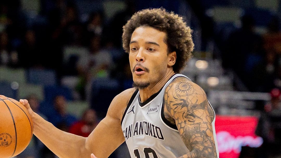 Dec 8, 2025; New Orleans, Louisiana, USA;  San Antonio Spurs forward Jeremy Sochan (10) brings the ball up court against New Orleans Pelicans guard Jose Alvarado (15) during the first half at Smoothie King Center. Mandatory Credit: Stephen Lew-Imagn Images