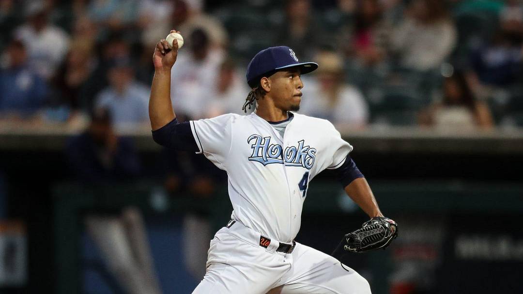 Hooks pitcher Miguel Ullola throws a pitch on Opening Night at Whataburger Field on Friday, April 5, 2024, in Corpus Christi, Texas.