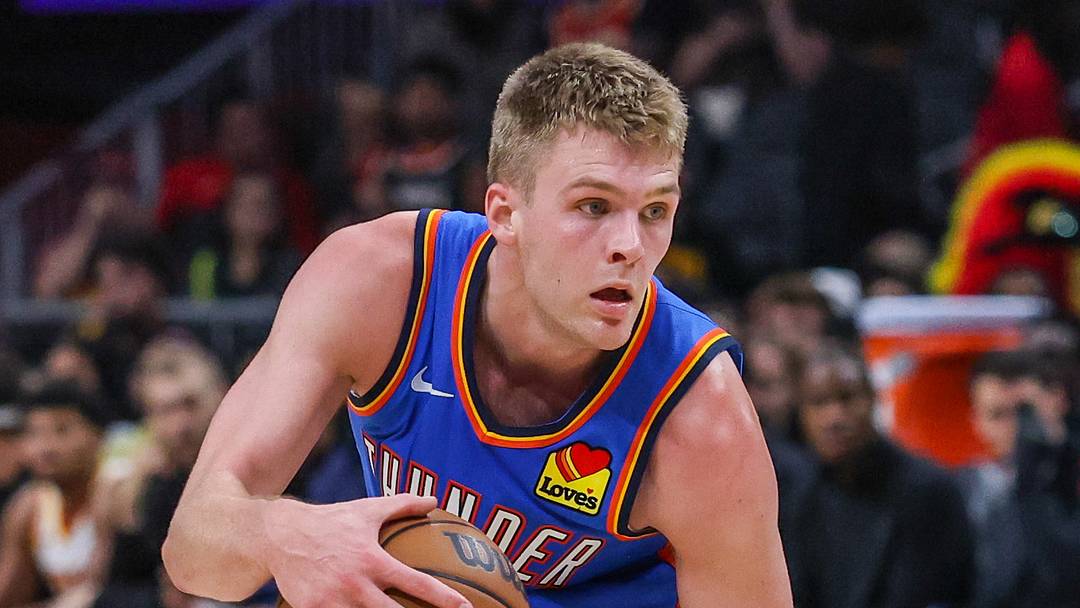 Oct 12, 2026; Atlanta, Georgia, USA;  Oklahoma City Thunder guard Bennett Stirtz (14) dribbles against Atlanta Hawks forward Zuby Ejiofor (20) during the fourth quarter at State Farm Arena.  Mandatory Credit: Jordan Godfree-Imagn Images