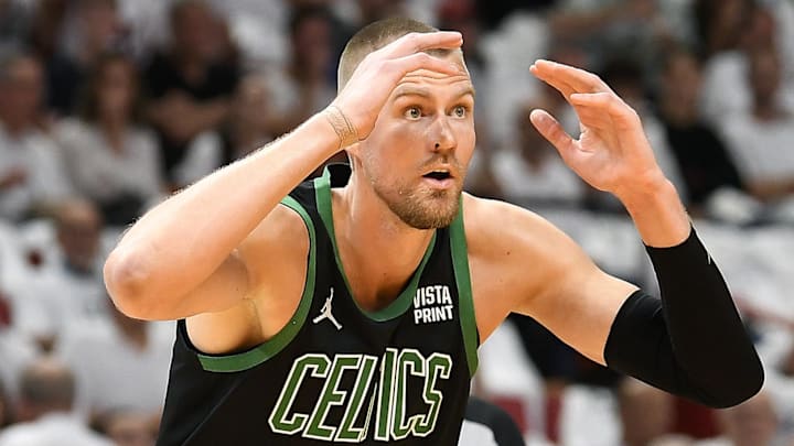 Apr 29, 2024; Miami, Florida, USA; Boston Celtics center Kristaps Porzingis (8) reacts to a foul call while playing the Miami Heat during the first quarter of game four of the first round for the 2024 NBA playoffs at Kaseya Center. Mandatory Credit: Michael Laughlin-Imagn Images
