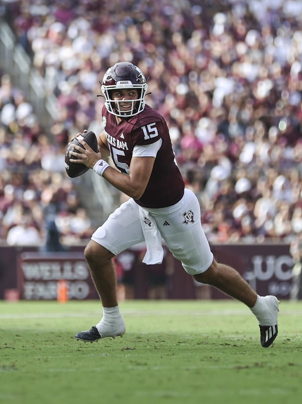 Texas A&M Aggies quarterback Conner Weigman (15) rolls out of the pocket on a play during the second quarter. 