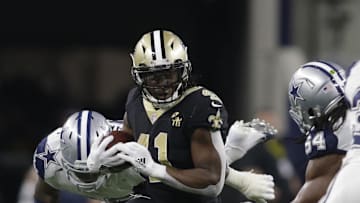 Nov 29, 2018; Arlington, TX, USA; New Orleans Saints running back Alvin Kamara (41) runs the ball against Dallas Cowboys middle linebacker Jaylon Smith (54) in the fourth quarter at AT&T Stadium. Mandatory Credit: Tim Heitman-Imagn Image