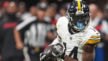 Sep 8, 2024; Atlanta, Georgia, USA; Pittsburgh Steelers wide receiver George Pickens (14) runs against the Atlanta Falcons after a catch at Mercedes-Benz Stadium. Mandatory Credit: Dale Zanine-Imagn Images