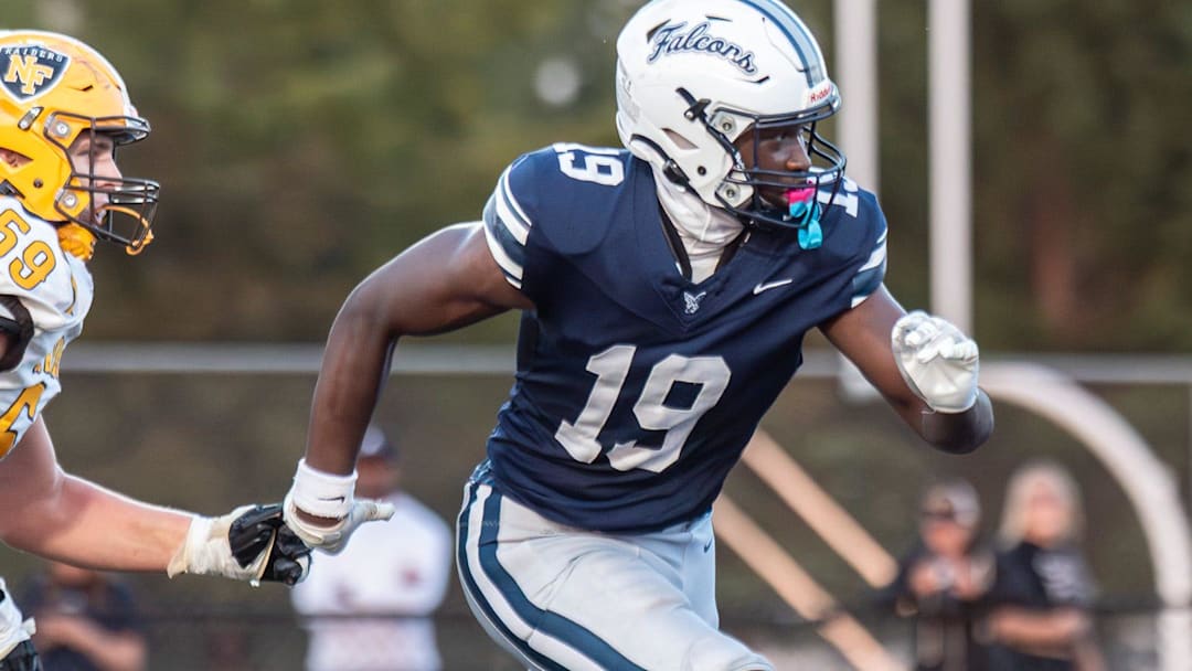 Farmington's Myles Smith rushes the passer during a game last season.