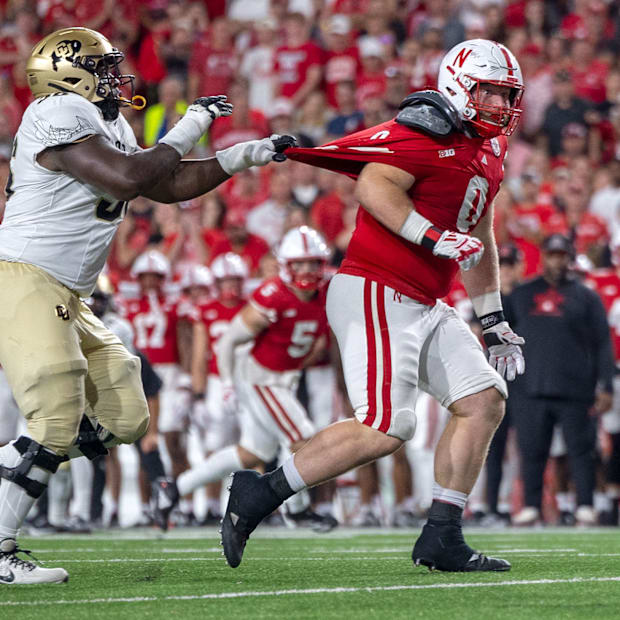 Nebraska defensive lineman Nash Hutmacher chases after Colorado quarterback Shedeur Sanders during the third quarter.