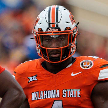 Aug 31, 2024; Stillwater, Oklahoma, USA; Oklahoma State Cowboys linebacker Nick Martin (4) ready for a play during the fourth quarter against the South Dakota State Jackrabbits at Boone Pickens Stadium. Mandatory Credit: William Purnell-Imagn Images