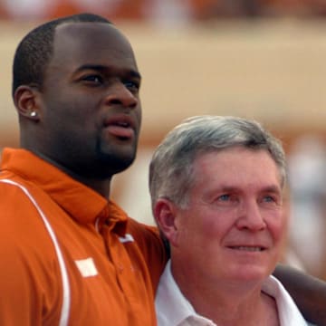 August 30, 2008; Austin, TX, USA; Tennessee Titans quarterback and former Texas Longhorn player Vince Young hugs Texas Longhorns head coach Mack Brown prior to a game against the Florida Atlantic University Owls at Darrell K Royal-Texas Memorial Stadium. Mandatory Credit: Brendan Maloney-Imagn Images