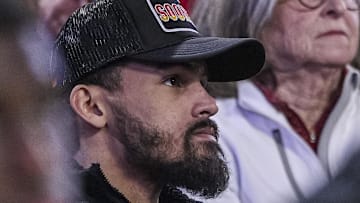 Trae Young #11 of the Atlanta Hawks watches a game between the Oklahoma Sooners and Georgia Bulldogs.