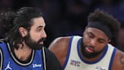 Orlando Magic center Goga Bitadze looks to post up against New York Knicks center Mitchell Robinson.