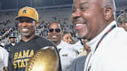 Alabama State Hornets head coach Eddie Robinson Jr. and University President Quinton Ross, Jr., with the Magic City Classic Trophy at Legion Field in Birmingham, Ala., on Saturday October 26, 2024.