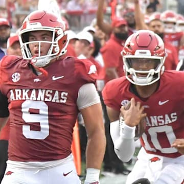 Arkansas Razorbacks quarterback Taylen Green runs into traffic behind tight end Luke Hasz near the goal against UAPB.