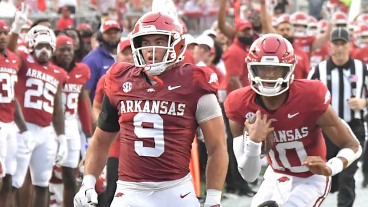 Arkansas Razorbacks quarterback Taylen Green runs into traffic behind tight end Luke Hasz near the goal against UAPB.