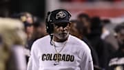 Oct 25, 2025; Salt Lake City, Utah, USA; Colorado Buffaloes head coach Deion Sanders looks on during a timeout in the game against the Utah Utes during the second quarter at Rice-Eccles Stadium. Mandatory Credit: Rob Gray-Imagn Images