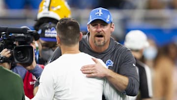 Jan 9, 2022; Detroit, Michigan, USA; Detroit Lions head coach Dan Campbell hugs Green Bay Packers head coach Matt LaFleur after the game at Ford Field. Mandatory Credit: Raj Mehta-Imagn Images