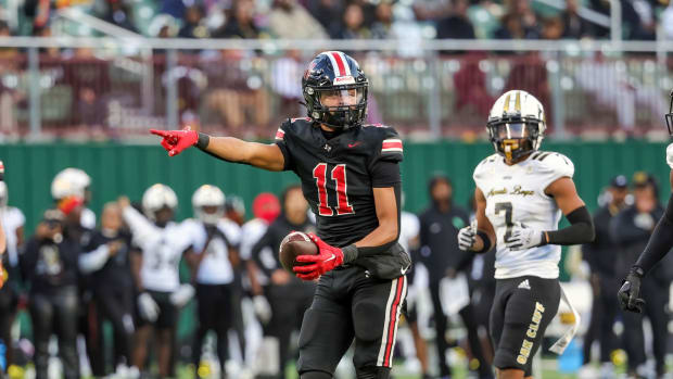 Daylan McCutcheon motions for a first down in a 2023 matchup with South Oak Cliff in a showdown of Texas high school powers.