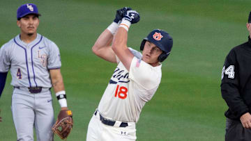 Auburn Tigers' Ike Irish (18) celebrates his double with a golf swing as Auburn Tigers take on LSU Tigers at Plainsman Park in Auburn, Ala., on Saturday, April 12, 2025.