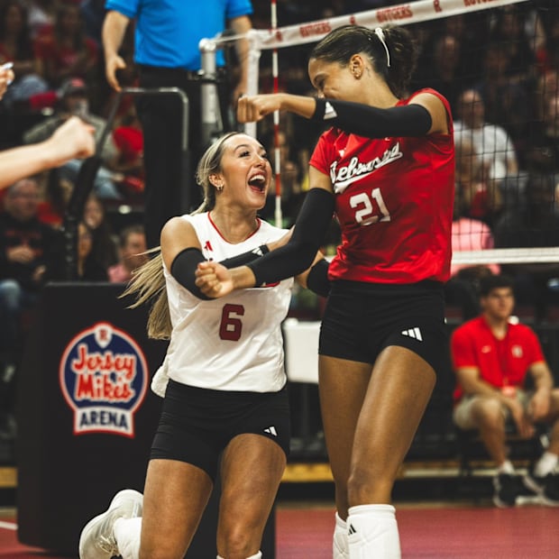 Laney Choboy, left, and Skyler Pierce celebrate a point against Rutgers on Saturday. 