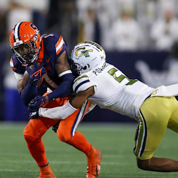 Nov 18, 2023; Atlanta, Georgia, USA; Syracuse Orange running back LeQuint Allen (1) is tackled by Georgia Tech Yellow Jackets defensive back Clayton Powell-Lee (5) in the second half at Bobby Dodd Stadium at Hyundai Field. Mandatory Credit: Brett Davis-Imagn Images