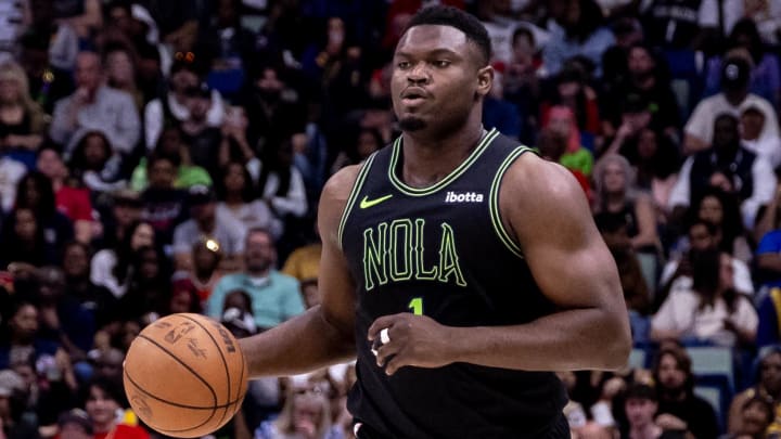 Apr 14, 2024; New Orleans, Louisiana, USA;  New Orleans Pelicans forward Zion Williamson (1) brings the ball up court against the Los Angeles Lakers during the first half at Smoothie King Center.