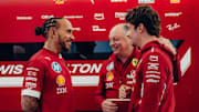 Ferrari drivers alongside Fred Vasseur in the garage