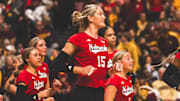 Andi Jackson runs onto the court to celebrate with her teammates after Nebraska finished off a sweep against Minnesota. Jackson led the Huskers with 15 kills.