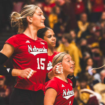 Andi Jackson runs onto the court to celebrate with her teammates after Nebraska finished off a sweep against Minnesota. Jackson led the Huskers with 15 kills.